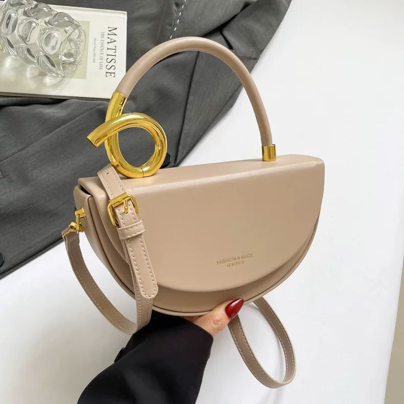 Chic Nude Half‑Moon Handbag with Gold Spiral Handle & Crossbody Strap