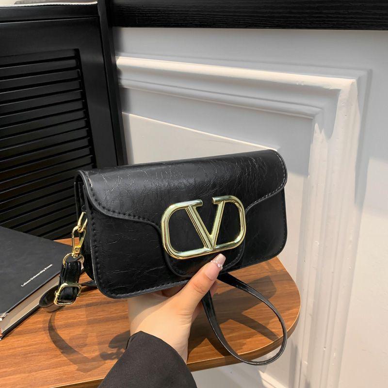 Classic Black Crossbody Sling Bag with Bold Gold “V” Logo