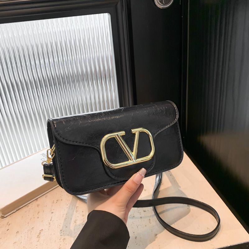 Classic Black Crossbody Sling Bag with Bold Gold “V” Logo