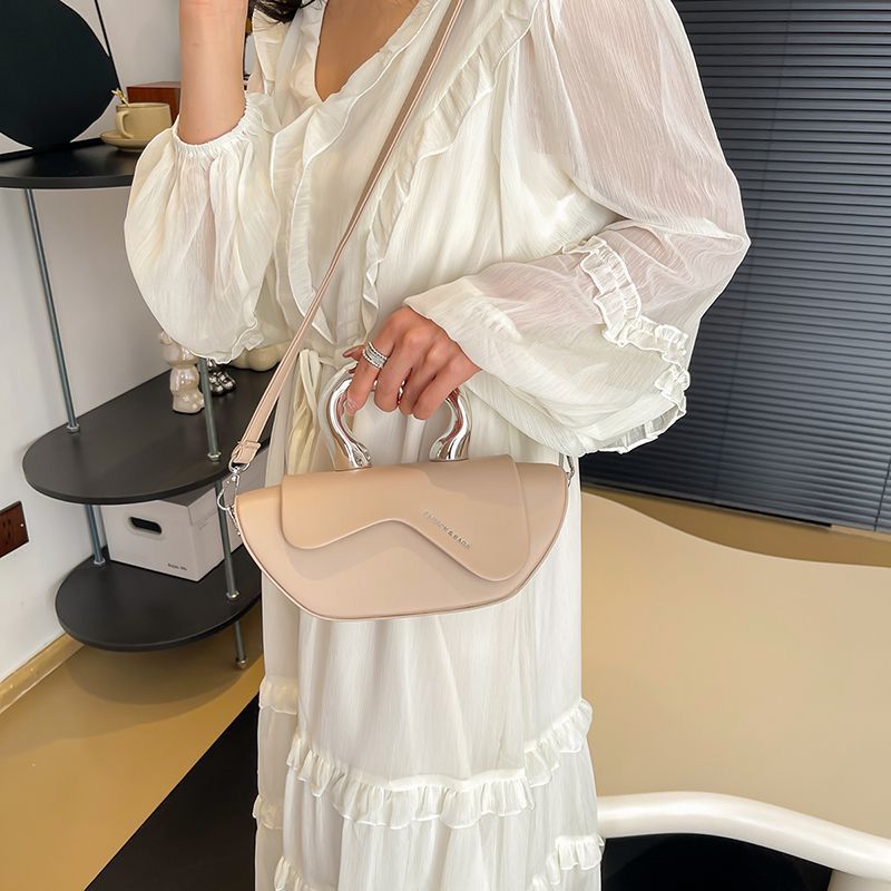 Elegant Nude Half‑Moon Handbag with Metal Handle & Crossbody Strap