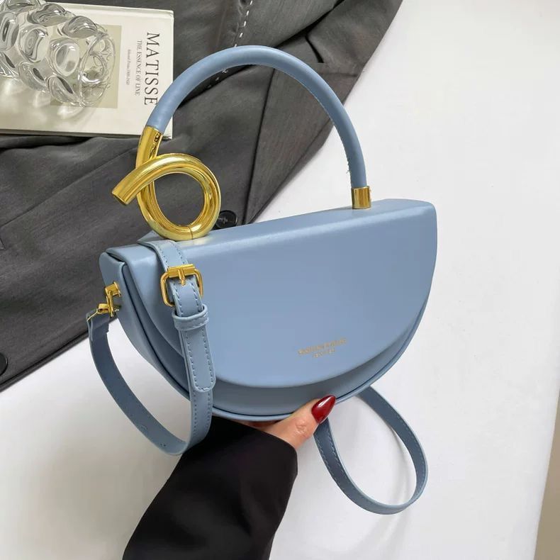 Chic Nude Half‑Moon Handbag with Gold Spiral Handle & Crossbody Strap